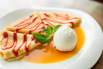pancakes with sauce, honey and ice cream