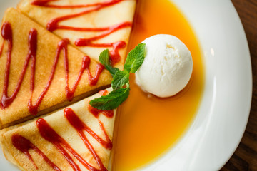 pancakes with sauce, honey and ice cream