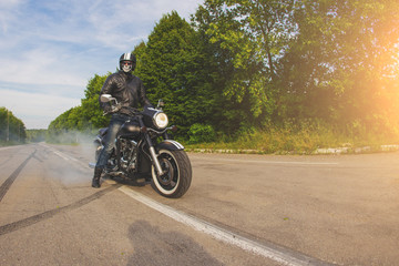 Fototapeta na wymiar slow motion, biker riding unknown motorbike with blur movement, speed concept