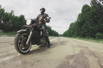 Fototapeta na wymiar slow motion, biker riding unknown motorbike with blur movement, speed concept