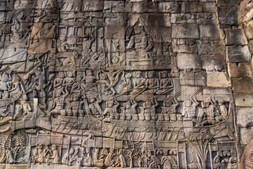 Relief on the wall of gallery of Bayon temple in Angkor Thom. Cambodia