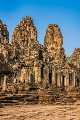 Naklejka premium Bayon temple in Angkor Thom, Cambodia: first enclosure wall, galleries and face towers.