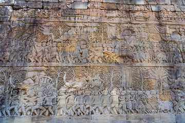 Relief on the wall of gallery of Bayon temple in Angkor Thom. Cambodia