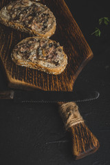 Slices of multigrain bread with sprats.