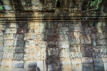 Relief on the wall of gallery of Bayon temple in Angkor Thom. Cambodia