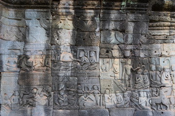 Relief on the wall of gallery of Bayon temple in Angkor Thom. Cambodia