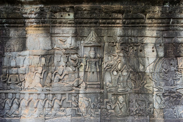 Relief on the wall of gallery of Bayon temple in Angkor Thom. Cambodia