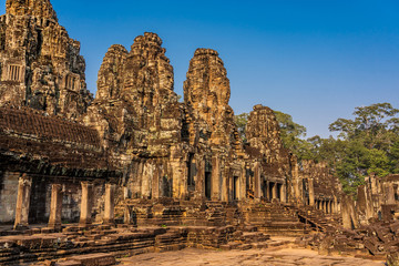 Fototapeta na wymiar Bayon temple in Angkor Thom, Cambodia: first enclosure wall, galleries and face towers.