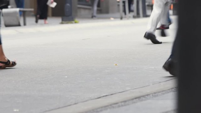 Closeup Shot of People's Feet Running Across the Street in Downtown Vancouver
