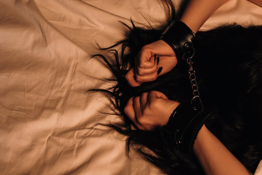 girl hands in handcuffs for BDSM sex with domination