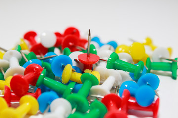  Colorful pushpins on white background