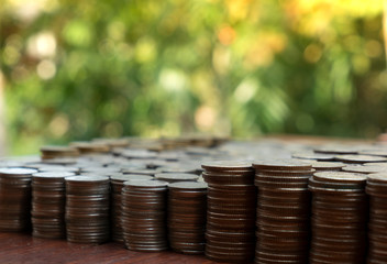 Lots stack coins baht Thailand on wooden desk background texture, Money for business planning...