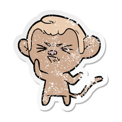 distressed sticker of a cartoon annoyed monkey