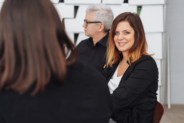 Fototapeta na wymiar Smiling woman in a business meeting