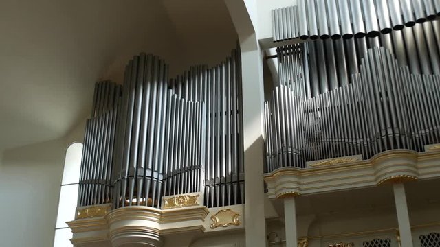 Close up of beautiful old organ pipes for music inside a church