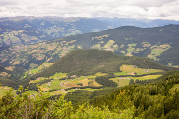 Obraz premium Alpe di Siusi, Seiser Alm with Sassolungo Langkofel Dolomite, a view of a large mountain in the background