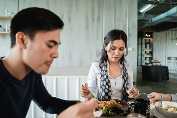 group of friends enjoy eating together in a restaurant