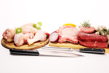 raw meat. Different types of raw pork meat, chicken and beef with spices and herbs