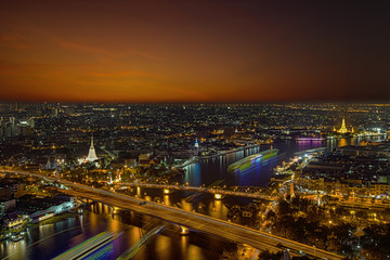 Fototapeta na wymiar City Scape, Panorama of Chao Praya River. River view overlooking the Phra Phuttha Yodfa Bridge or Memorial Bridge and Wat Arun with grand Palace in the background, Bangkok Thailand. 26 January 2019.