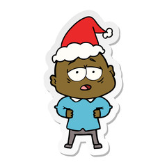 sticker cartoon of a tired bald man wearing santa hat