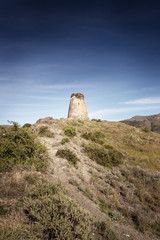 Fototapeta na wymiar old stone watchtower in almunecar spain