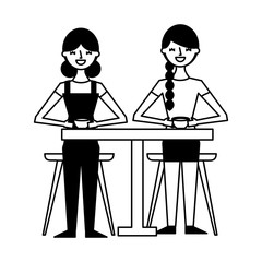 two women drinking coffee