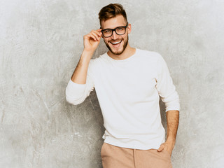 Portrait of handsome smiling hipster lumbersexual businessman model wearing casual summer white...
