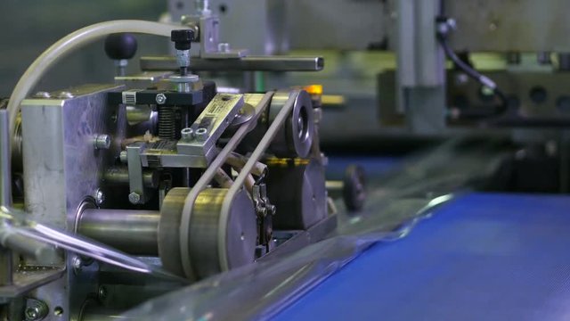 Conveyor at the plant packages products for repair