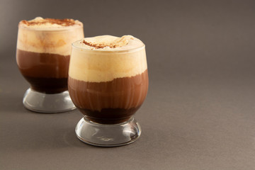 Coffee affogato with vanilla ice cream and espresso. Glass with coffee drink and icecream. Copy space.