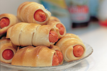 Close up of a homemade baked sausages in dough.