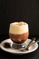Coffee affogato with vanilla ice cream and espresso. Glass with coffee drink and icecream. Copy space.