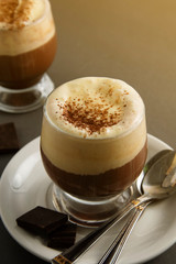 Coffee affogato with vanilla ice cream and espresso. Glass with coffee drink and icecream. Copy space.