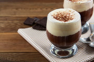 Coffee affogato with vanilla ice cream and espresso. Glass with coffee drink and icecream.