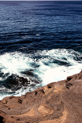 waves crashing on rocks