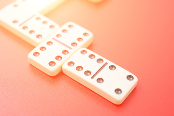 Dominoes on red table