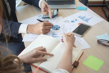 Businessmen are analyzing graphs and increasing sales next year, Closeup business analysis and strategy concept. - image