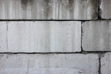 Real Old damaged concrete block wall background texture.
