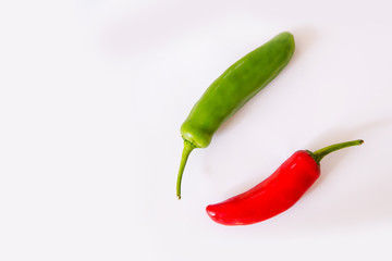 medium hot serenade chillies whole red and green white background
