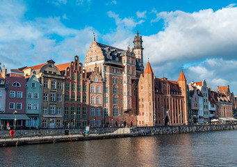 Fototapeta na wymiar Waterfront promenade in Gdansk alongside Motlawa River, old town, very popular tourist location.