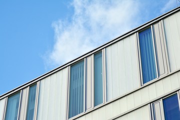 Sky reflected in a modern building glass facade