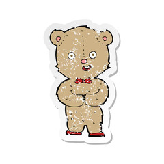 retro distressed sticker of a cartoon teddy bear