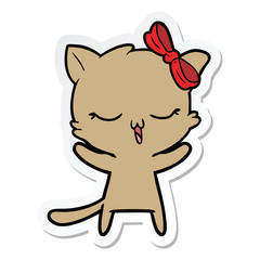 sticker of a cartoon cat with bow on head