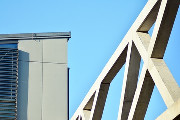 Abstract image of looking up at modern glass and concrete building. Architectural exterior detail of office building. 