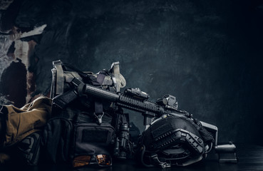 Military uniform and equipment. Body armor, gun, assault rifle, helmet, night vision goggles....