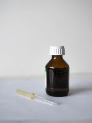 eyedropper for medication on a light background . health