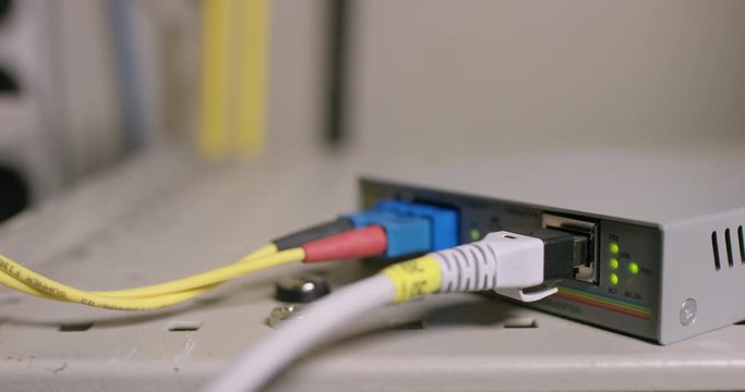 Backside of old cable modem with flickering lights