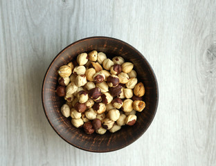 Healthy food  for background image close up hazelnuts.  Nuts texture on white grey table top view
