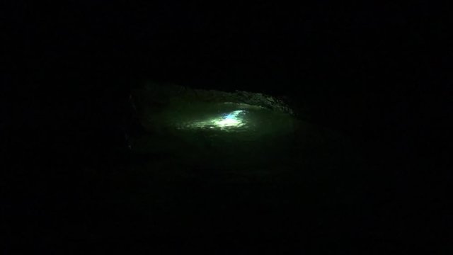Diver returns to the entry sump from a long, cold cave dive