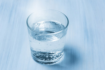 A glass of pure mineral water on the table