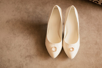 white wedding shoes with rings